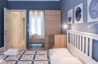 A bed or beds in a room at Speranza by halu! Apartment next to Efkleidis metro station