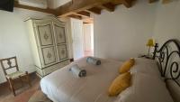 A bed or beds in a room at Il Mulino di Hotel Villa Aurora