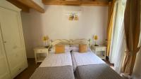 A bed or beds in a room at Il Mulino di Hotel Villa Aurora