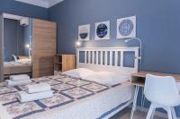 A bed or beds in a room at Speranza by halu! Apartment next to Efkleidis metro station