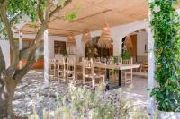 a dining room with a table and chairs at Valley Club Ibiza - Boutique Agroturismo in Sant Joan de Labritja