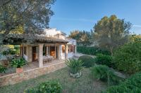 a home with a patio and a yard at Chalet Son Gomila in the North of Mallorca in Cielo de Bonaire 