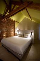 Posteľ alebo postele v izbe v ubytovaní L'authentik petit hôtel LE REFUGE DE MAMIE YO