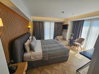 a hotel room with a bed and a living room at Anthemis Hotel in Istanbul