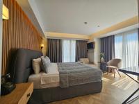 a hotel room with a bed and a living room at Anthemis Hotel in Istanbul