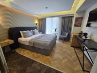 a hotel room with a bed and a desk at Anthemis Hotel in Istanbul