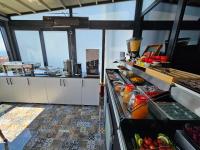 a kitchen with a buffet of food in a room at Anthemis Hotel in Istanbul