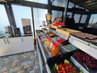 a kitchen with a buffet with fruits and vegetables at Anthemis Hotel in Istanbul