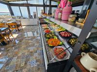 a buffet line with many different plates of food at Anthemis Hotel in Istanbul