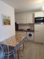 Kuchyňa alebo kuchynka v ubytovaní Appartement avec piscine proche plage et commerces