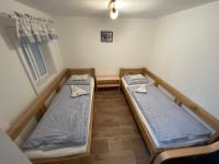 Postel nebo postele na pokoji v ubytování Sokolí hnízdo