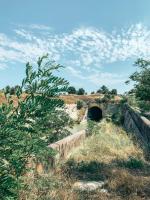 a small tunnel in the middle of a field at Aux Berges du Canal in Capestang