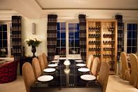 a dining room with a long table and chairs at Maxim Pasha Hotel in Chişinău