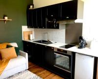 Kuchyňa alebo kuchynka v ubytovaní Appartement Cosy proche Futuroscope