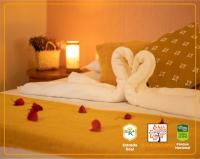 a hotel room with swans made out of towels at POUSADA VILA ACONCHEGO- Sossego- Em Meio Há Mata Nativa- by MARCOS MICOZZI in Serra do Cipo