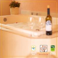 a bottle of wine sitting on top of a sink at POUSADA VILA ACONCHEGO- Sossego- Em Meio Há Mata Nativa- by MARCOS MICOZZI in Serra do Cipo