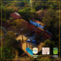 an overhead view of a house with a swimming pool at POUSADA VILA ACONCHEGO- Sossego- Em Meio Há Mata Nativa- by MARCOS MICOZZI in Serra do Cipo