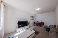 Televízia a/alebo spoločenská miestnosť v ubytovaní A1 - spacious apt on the seafront with terrace