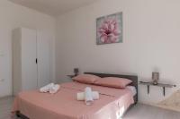 Posteľ alebo postele v izbe v ubytovaní A1 - spacious apt on the seafront with terrace