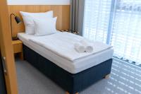 Postel nebo postele na pokoji v ubytování Hotel Smetanova