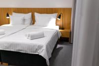 Postel nebo postele na pokoji v ubytování Hotel Smetanova