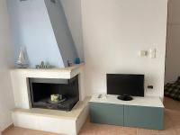 Televízia a/alebo spoločenská miestnosť v ubytovaní Sea View Apartments 2