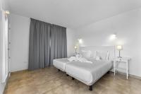 Posteľ alebo postele v izbe v ubytovaní Apartamentos Arrecife Playa