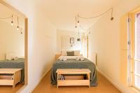 Postel nebo postele na pokoji v ubytování Casa 128 by LovelyStay