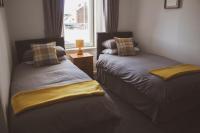 THE EARN HOTELにあるベッド
