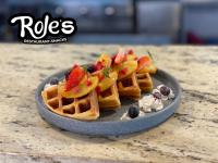een bord wafels met fruit en slagroom bij Auroza Resort in Rincon de Guayabitos