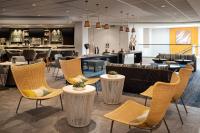 a lobby of a hotel with chairs and a bar at San Francisco Marriott Fisherman's Wharf in San Francisco