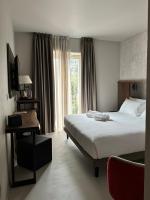 Villa Clementina Boutique Hotelにあるベッド