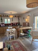 a kitchen with a table and chairs in a room at Studio provençal atypique avec jacuzzi privé in Sanary-sur-Mer