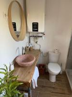 a bathroom with a sink and a toilet at Studio provençal atypique avec jacuzzi privé in Sanary-sur-Mer