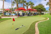 a golf course with red umbrellas and golf balls on it at Marriott&#39;s Legends Edge at Bay Point in Panama City Beach