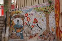 a mosaic wall with a painting on it at Sous le Clocher in Marseille