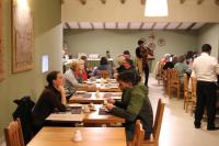 a group of people sitting at tables in a restaurant at Hotel Villa Urubamba in Urubamba