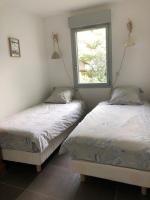 Posteľ alebo postele v izbe v ubytovaní Appartement T3 à 2mn de la Plage