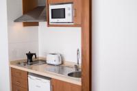 Kuchyňa alebo kuchynka v ubytovaní Bossa Bay - MC Apartments Ibiza