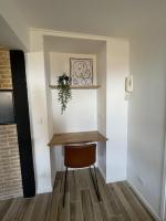 a small room with a table and a chair at Villa Corbelle - Grand Studio in Cannes