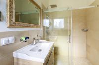 a bathroom with a sink and a shower with a mirror at Sea terace apartment between Nice and Monaco - 3 in Villefranche-sur-Mer
