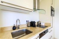 a kitchen with a sink and a counter top at Sea terace apartment between Nice and Monaco - 3 in Villefranche-sur-Mer