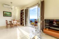 a living room with a view of the ocean at Sea terace apartment between Nice and Monaco - 3 in Villefranche-sur-Mer