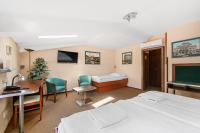Łóżko lub łóżka w pokoju w obiekcie Hotel Palace