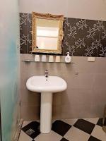 a bathroom with a sink and a mirror at 水社海民宿 in Yuchi