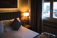 Łóżko lub łóżka w pokoju w obiekcie Lake Hotel La Pieve