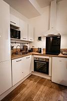 Kuchnia lub aneks kuchenny w obiekcie BELLE REINE - 3 APPARTEMENTS EN COEUR DE CENTRE-VILLE