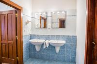 a bathroom with two sinks and a mirror at Hostel Little Quarter in Prague