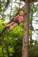 a person hanging from a tree with a racket at Hôtel Club mmv Le Flaine *** in Flaine