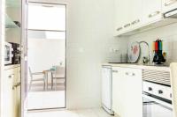 Kuchyň nebo kuchyňský kout v ubytování Apartamento Pink VistaBella Sunrise